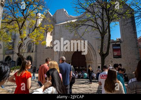 Tourists outside the Carmo Convent, destroyed in the 1755 Earthquake, Lisbon, Portugal Stock Photo