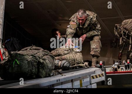 July 14, 2022 - Poznan, Poland: U.S. Soldiers from 3rd Armored Brigade Combat Team, 1st Cavalry Division unload equipment after arriving in Poznan, Poland July 14, 2022. The 1st Cavalry Division is proudly working alongside NATO allies and regional security partners to provide combat-credible forces to V Corps, Americas forward deployed corps in Europe. Credit: U.S. Army/ZUMA Press Wire Service/ZUMAPRESS.com/Alamy Live News Stock Photo