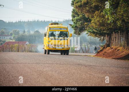 Yellow school bus in Africa. Education in Kenya, illustration photo. Edit space. Stock Photo