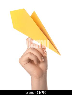 Woman with yellow paper plane on white background Stock Photo