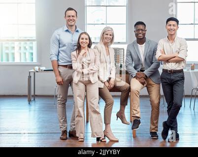 Team, unity and support in a modern office of diverse workers, smiling and looking confident. Portrait of a group of relaxed, proud lawyers working Stock Photo