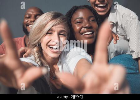 Group of friends, men and women having fun, smiling and being carefree while bonding together in the city. Young, happy, smiling and cheerful female Stock Photo