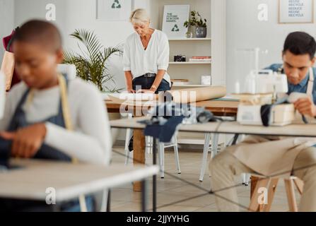 Fashion, design and style with young, diverse designers sewing stylish clothing using machines. Focused, young and creative colleagues creating new Stock Photo