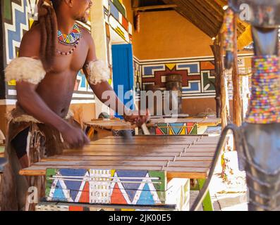 Johannesburg South Africa - August 13 2027; Blurred hands in motion striking African style wooden xylophone in tourist attraction. Stock Photo