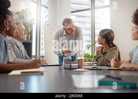 This is what we stand for. a mature businessman talking in a meeting at work. Stock Photo