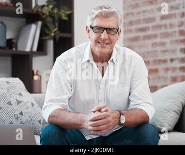 Time to chill. Portrait of an older man relaxing on the sofa at home. Stock Photo