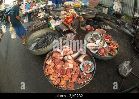 PHICHIT , THAILAND - AUGUST 29,2020 : Unidentified elderly vendors sell grilled catfish and a variety of fresh fish in the morning market. Stock Photo