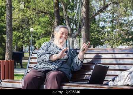 laptop and smartphone, using technology and social media older people can communicate with each other from any corner of globe. business concept. Gran Stock Photo