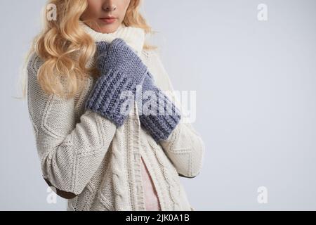 Cropped image of young woman in warm clothes Stock Photo