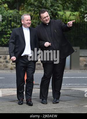 File photo dated 1/8/2015 of Father Dermott Donnelly (left) outside St Michael's Church, Elswick, Newcastle, ahead of the wedding of his brother Declan Donnelly and Ali Astall. A Requiem Mass will be held for the brother of TV star Dec. The popular priest, who had recently celebrated 30 years of service in the Catholic church, died earlier this month in hospital after falling seriously ill. The Requiem Mass was being held at St Mary's Cathedral, Newcastle, on Friday lunchtime. Issue date: Friday July 29, 2022. Stock Photo