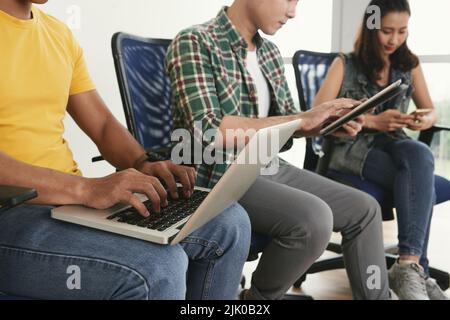 Cropped image of business people using various device in work Stock Photo