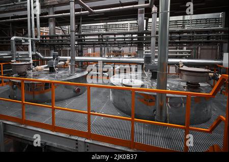 Huge brass tanks to produce chemical fertilizers at plant Stock Photo