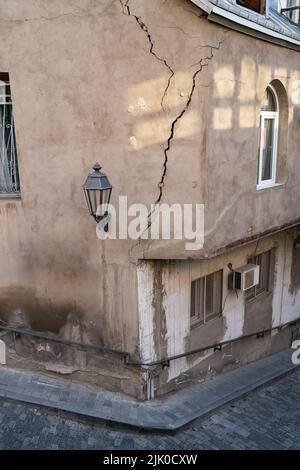 Cracked wall of house destroyed during strong earthquake in Tbilisi Georgia. Damage on buiding.  Stock Photo
