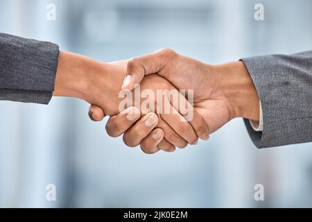 Ive heard so much about you. two businesspeople shaking hands. Stock Photo