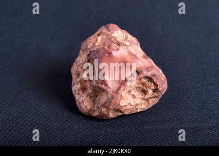 Fire Agate. Agate is a common rock formation, consisting of chalcedony and quartz as its primary components, with a wide variety of colors. Stock Photo