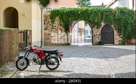 05 July 2022, Saxony, Grimma: A Simson S51 B moped stands in a