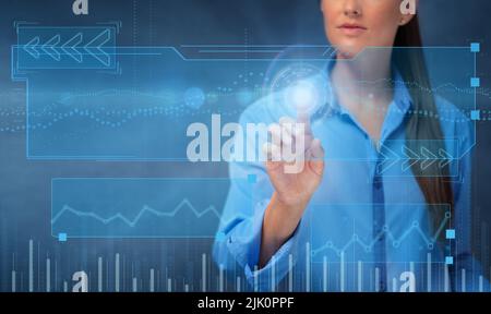 Young woman touching a virtual screen. Business technology Stock Photo
