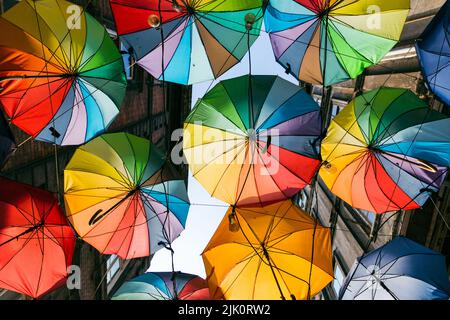 Colorful umbrellas hanging on the street in the karakoy district of Istanbul Stock Photo