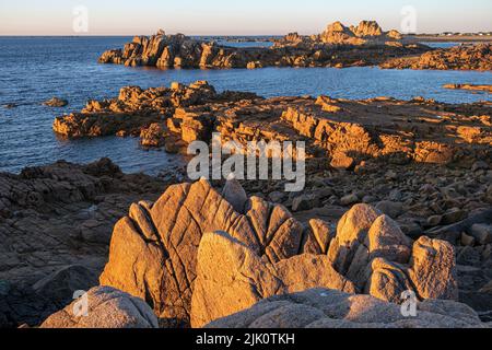 Last light on the rocky coast near Fort Hommet, Vazon Bay, Guernsey, Channel Islands Stock Photo