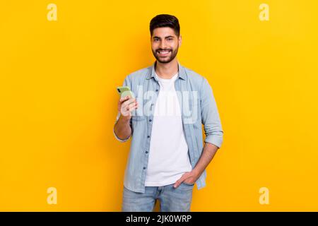Portrait of young guy business communicating employee distant work directly looking camera isolated on bright yellow background Stock Photo