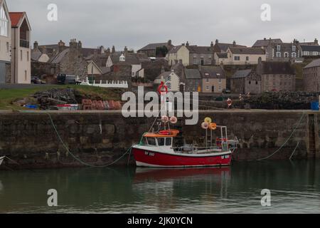 Boat in Portsoy Harbour, Portsoy, Aberdeenshire, Scotland, UK Stock Photo