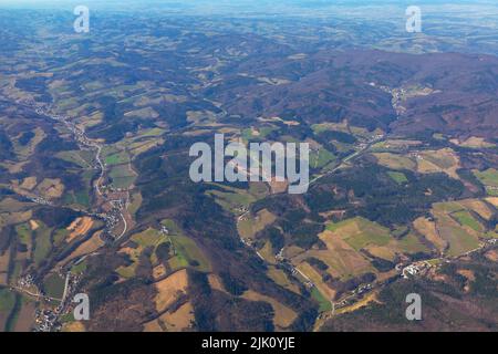 Rolling hills view from above . Flying over awesome natural landscape . Flight over Switzerland Stock Photo