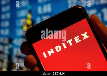 In this photo illustration, the biggest fashion group in the world Spanish multinational clothing company Inditex logo is displayed on a smartphone screen. (Photo by Budrul Chukrut / SOPA Images/Sipa USA) Stock Photo