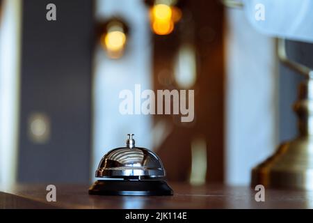 Hotel service bell on a table in hotel. Concept of hotel or restaurant Stock Photo