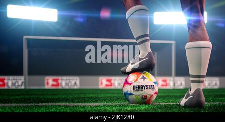 Guilherand-Granges, France - July 29, 2022. Bundesliga of Germany. Soccer player ready for the game with ball and official logo of the Bundesliga. 3D Stock Photo