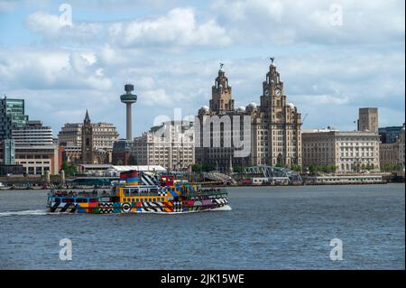 The Mersey ferry Snowdrop sailing in front of the Liverpool Waterfront, Liverpool, Merseyside, England, United Kingdom, Europe Stock Photo