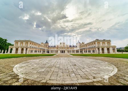 Great panoramic view of the main façade of the Aranjuez palace on a cloudy day at dawn. Madrid. Stock Photo