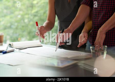 Cropped image of business people discussing information in financial reports Stock Photo