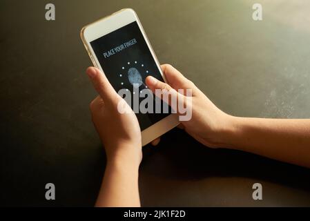 Hands of person touching smartphone screen for idefication Stock Photo