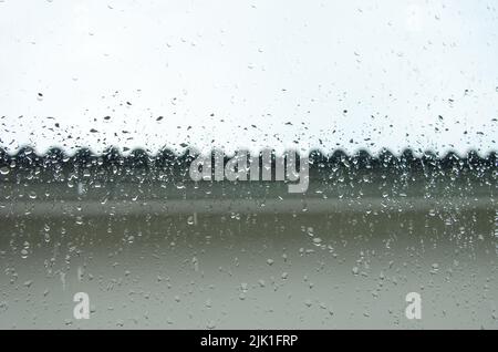 raindrops on the window of the house background Stock Photo