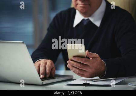 Cropped image of businesman reading messages on smartphone screen Stock Photo