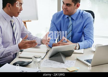 Multi-ethnic business team discussing ideas at the meeting Stock Photo