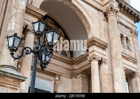 Scenic portal of Basilica of Saints Cosmas and Damian in Alberobello, Southern Italy Stock Photo