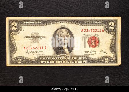 One 1953 US two dollar bill on a slate stone, close-up, top view Stock
