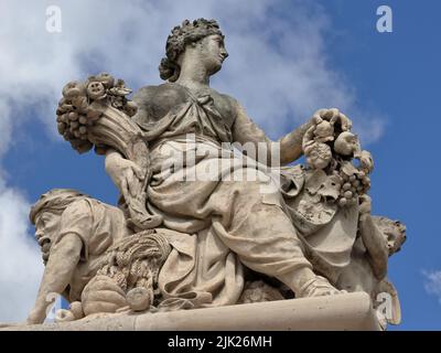 Antique statue in the park of Versailles palace near Paris, France Stock Photo