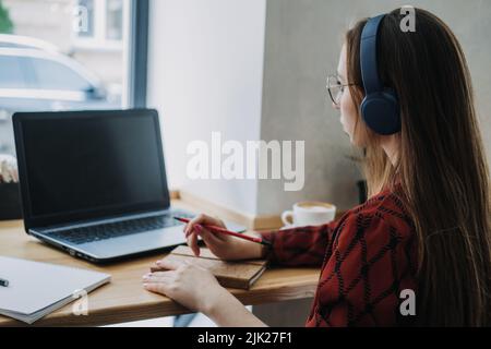 Outsourcing IT Projects, remote work, young professionals. female young programmer, developer working Stock Photo