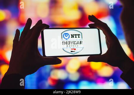 In this photo illustration, the NTT IndyCar Series logo is displayed on a smartphone screen. Stock Photo