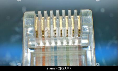 Network data internet cable connector RJ45 close up view. LAN head cable macro view. Stock Photo