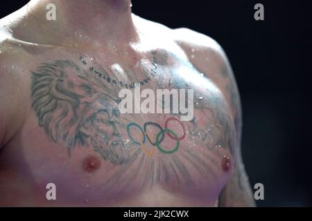 A detailed view of the tattoos of England's Jacob Peters in the Men's 50m Butterfly - Semi-Final 1 at Sandwell Aquatics Centre on day one of 2022 Commonwealth Games in Birmingham. Picture date: Friday July 29, 2022. Stock Photo