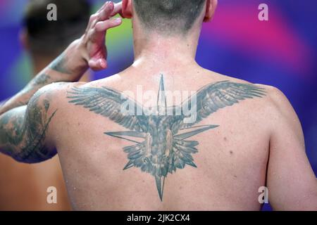 A detailed view of the tattoos of England's Jacob Peters in the Men's 50m Butterfly - Semi-Final 1 at Sandwell Aquatics Centre on day one of 2022 Commonwealth Games in Birmingham. Picture date: Friday July 29, 2022. Stock Photo