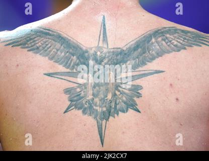 A detailed view of the tattoos of England's Jacob Peters in the Men's 50m Butterfly - Semi-Final 1 at Sandwell Aquatics Centre on day one of 2022 Commonwealth Games in Birmingham. Picture date: Friday July 29, 2022. Stock Photo