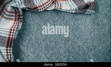 Kitchen towel or napkin over the rustic concrete table. View from above with copy space Stock Photo