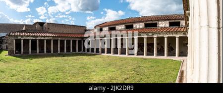 OPLONTIS, ITALY - MAY 03, 2022 - Garden and colonnade of the ancient Roman Villa Oplontis near Pompeii, Italy Stock Photo