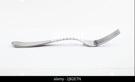 fork isolated on white background. metal fork. vintage fork cutlery side view Stock Photo