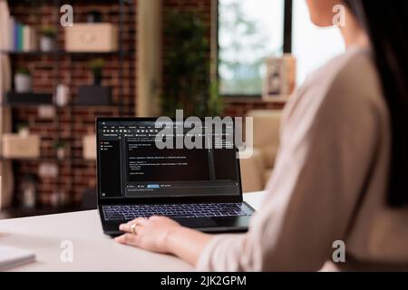 Software developer learning new program code on terminal window, using online cloud app server at home. Programming new user interface with css html script and application development. Stock Photo