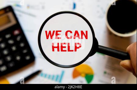 Paper note written with WE CAN HELP inscription on cork board Stock Photo